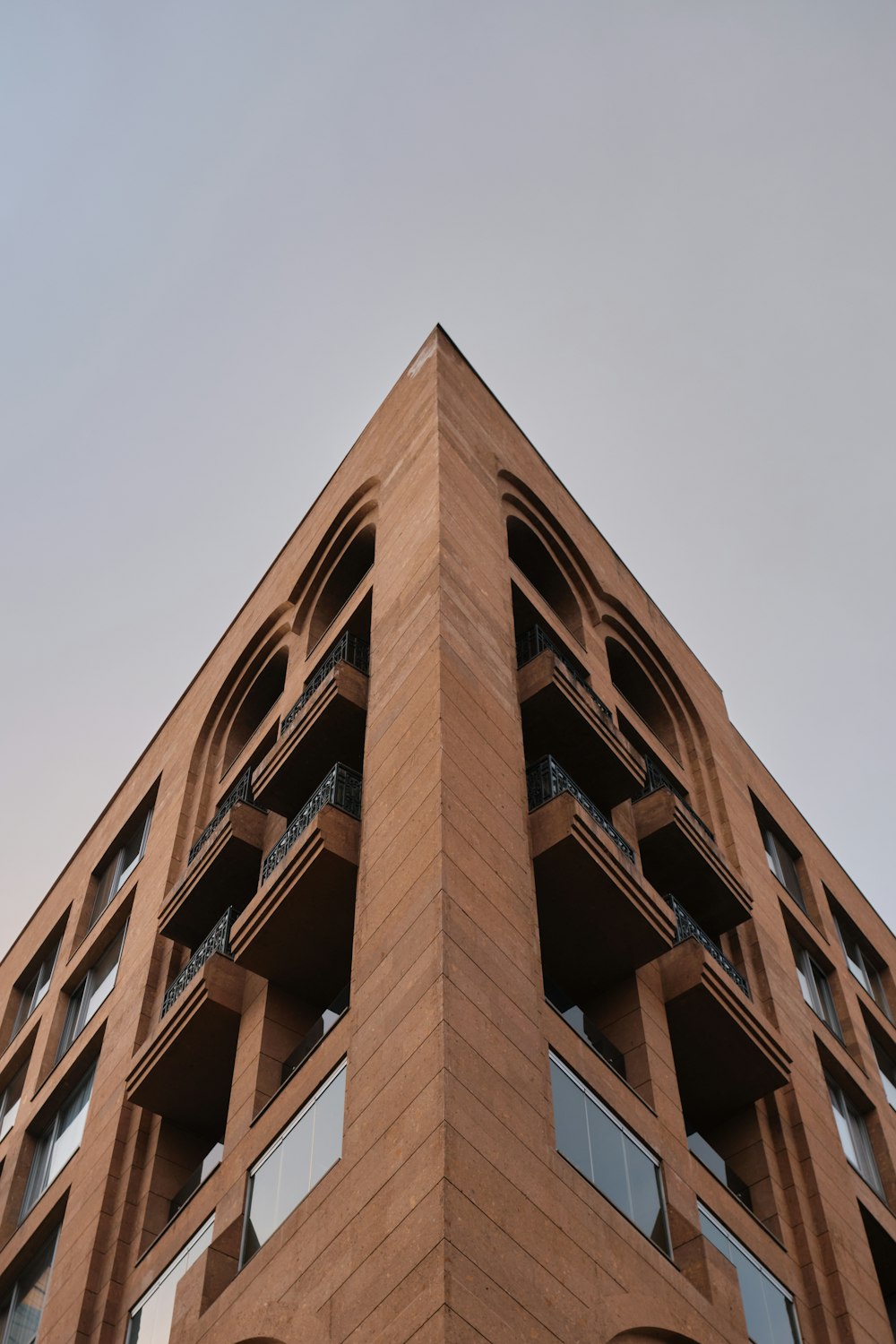 a tall brick building with balconies and balconies