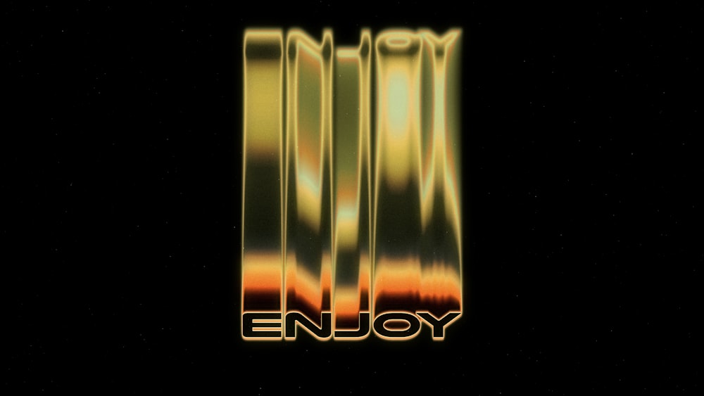 a black background with the word enjoy written in gold