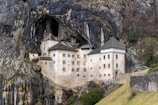 a castle built into the side of a cliff