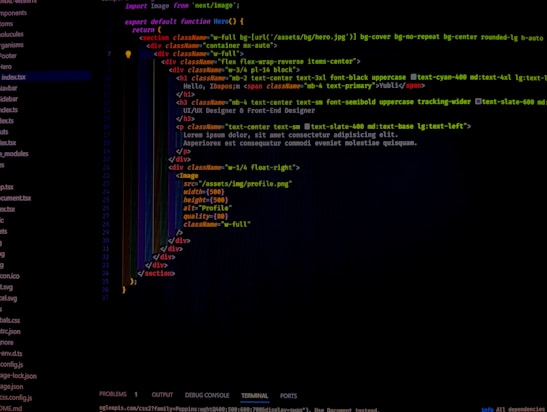A computer screen displays software code in a text editor. The code seems to be related to a web page with HTML and CSS components. On the left side, a file tree shows various file names in a project. The code includes HTML structure and styling classes.