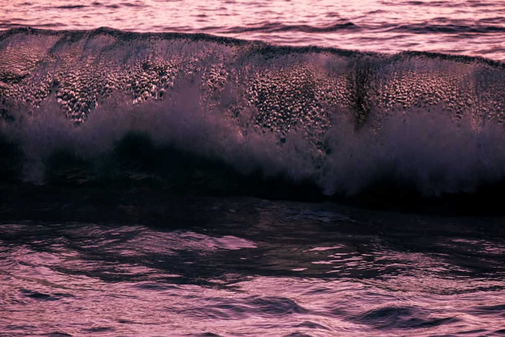 a large wave is coming in to the shore