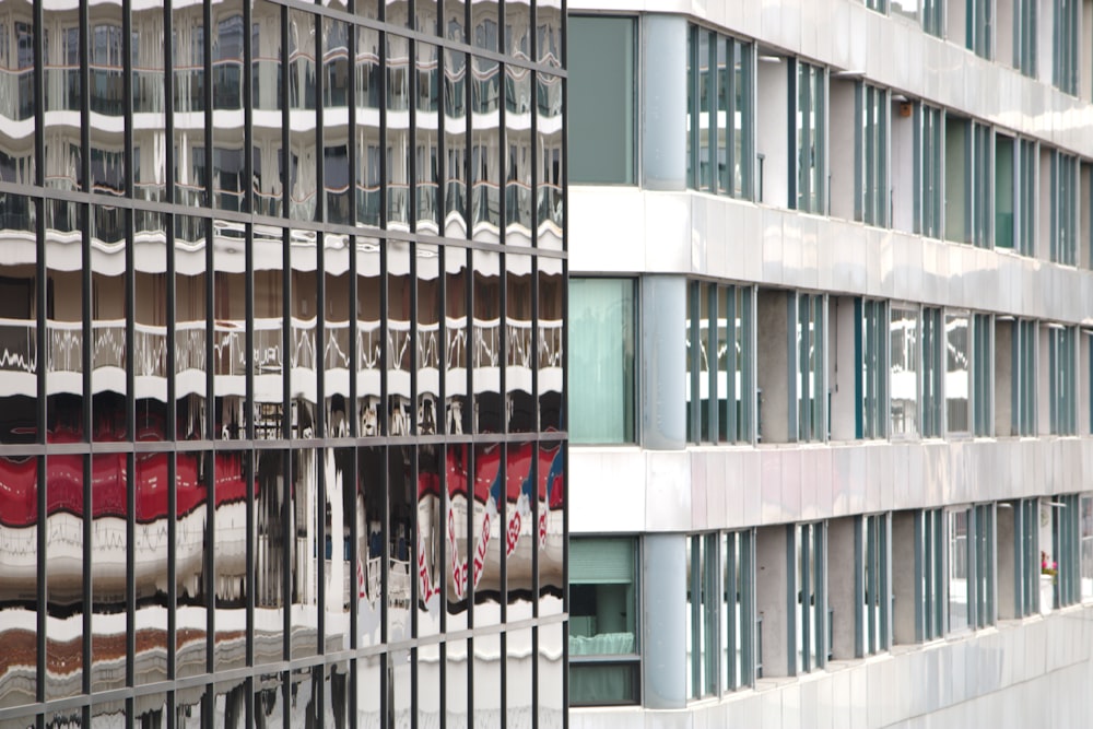 the reflection of a building in the windows of another building