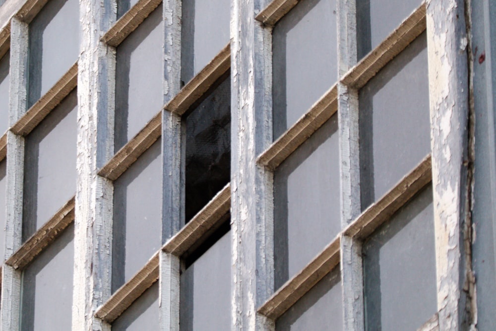 a window with bars on the side of a building