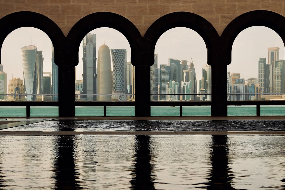 a view of a city from a pool of water