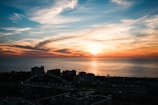 A beautiful sunset over a calm ocean horizon.