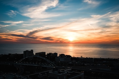 A beautiful sunset over a calm ocean horizon.