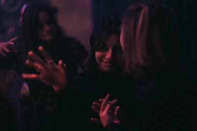 Close-up shot of a playful scene from an adult video with warm lighting.