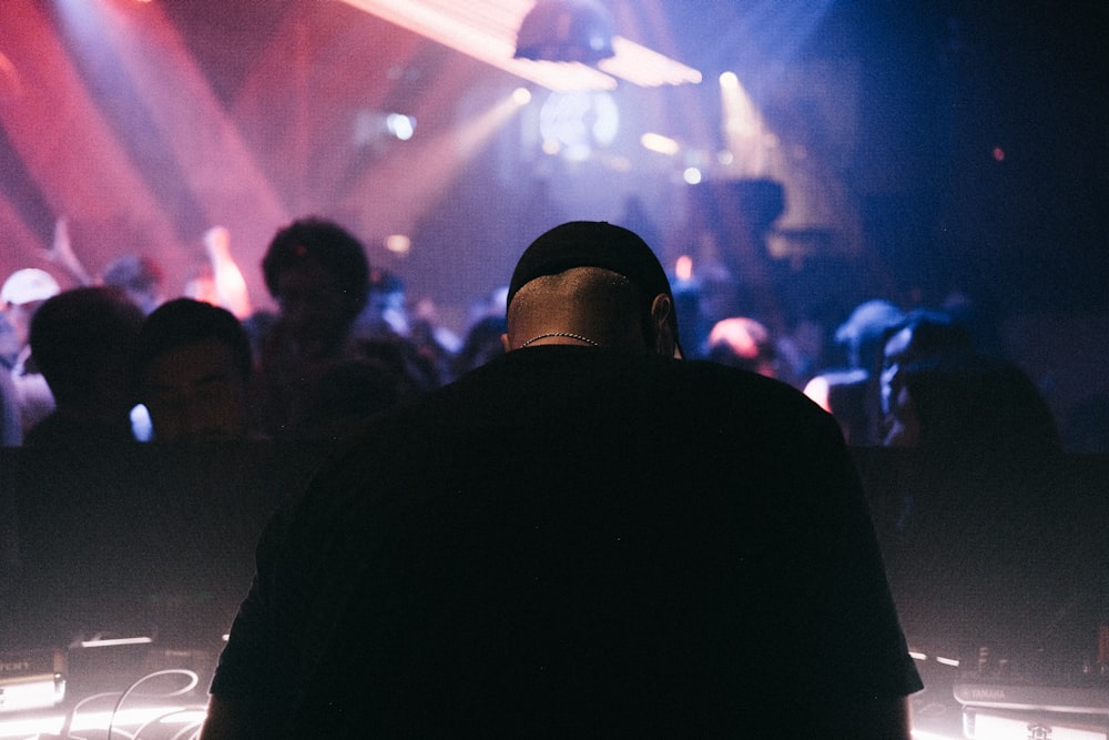 a man standing in front of a crowd of people