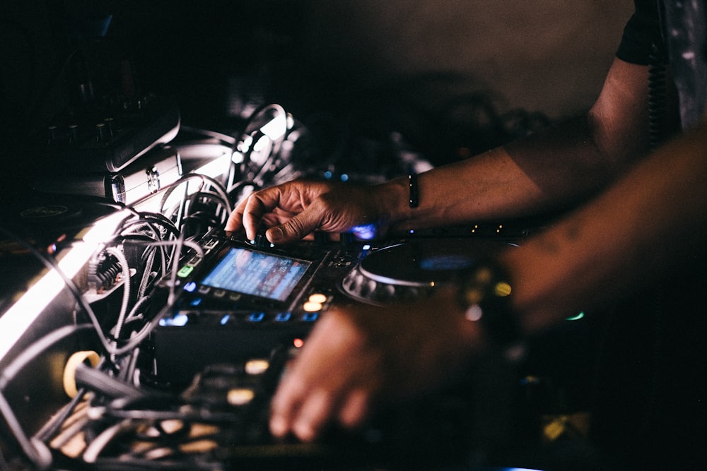 a dj mixing music in a dark room