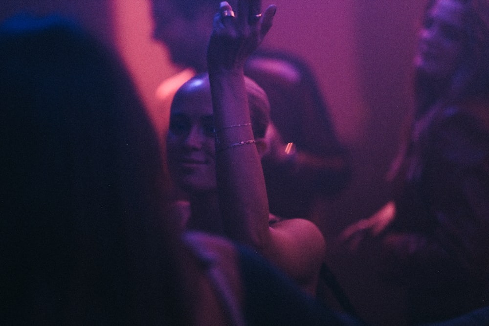 a woman holding a cell phone up to her ear