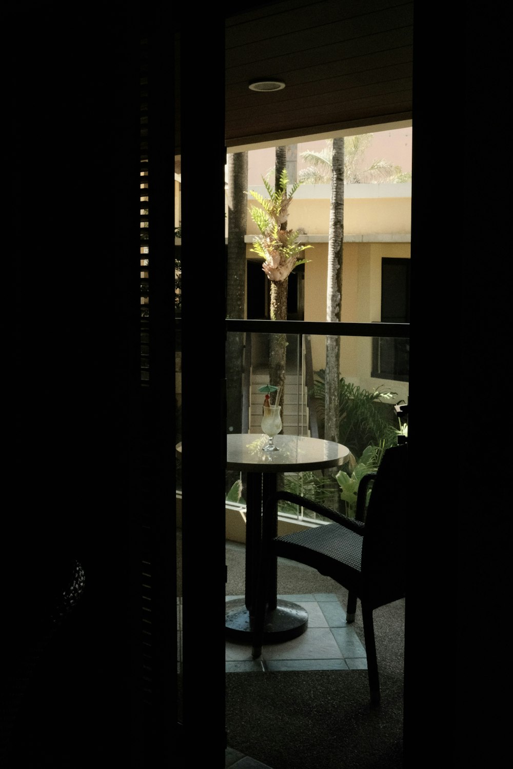 a view of a table and chairs from a balcony