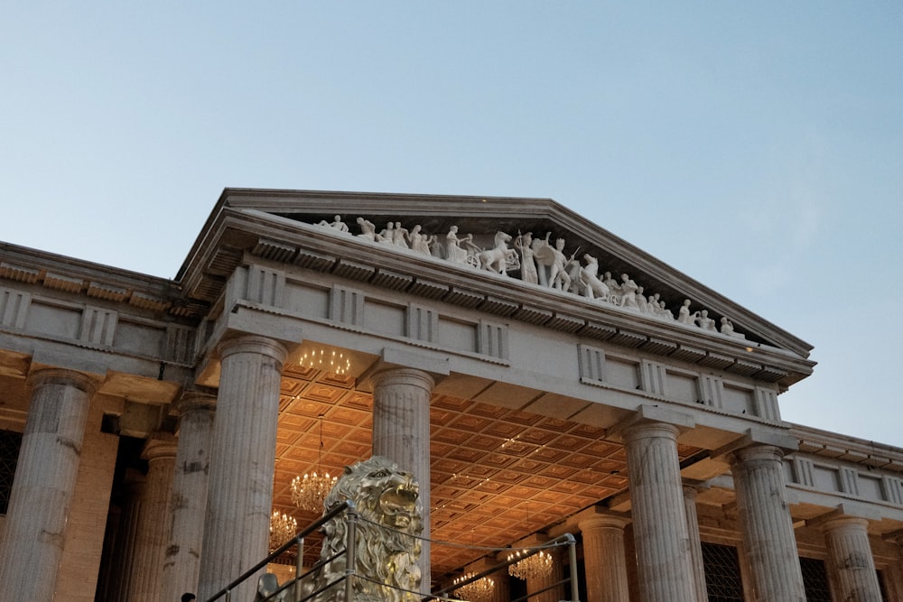 a large building with statues on top of it