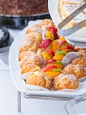 An inviting display of assorted pastries arranged on a ceramic platter with earthy tones.