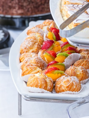 An inviting display of assorted pastries arranged on a ceramic platter with earthy tones.