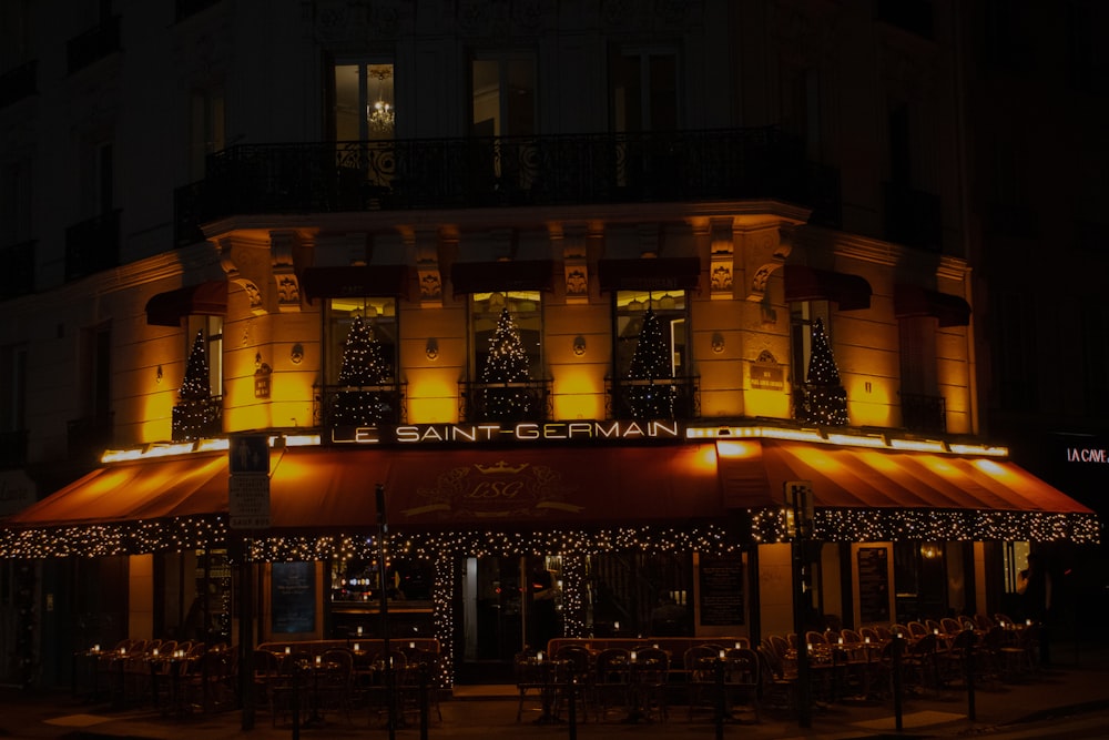 a building lit up at night with lights on it