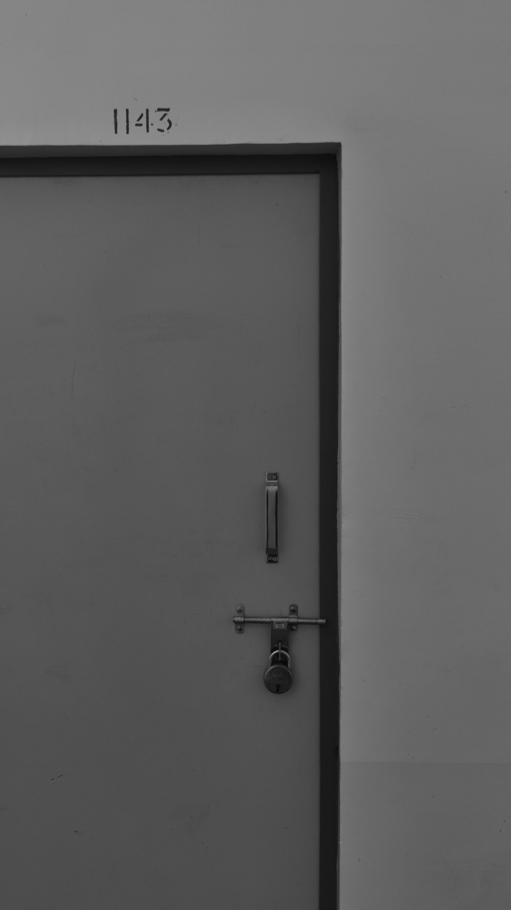 a black and white photo of a door