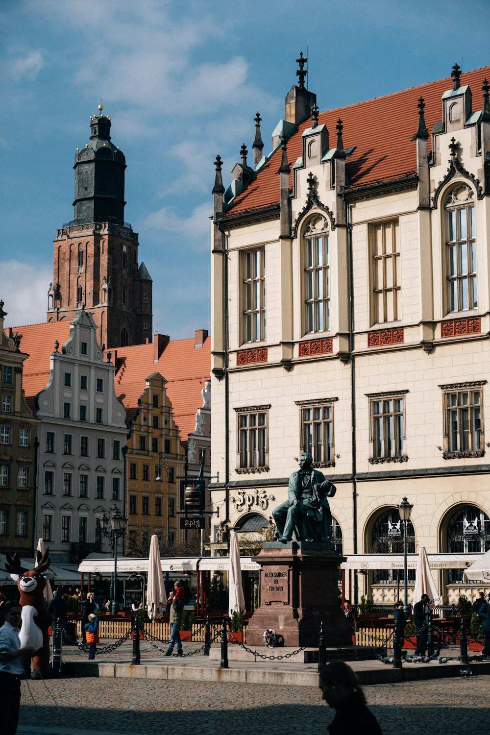 a large building with a statue in front of it