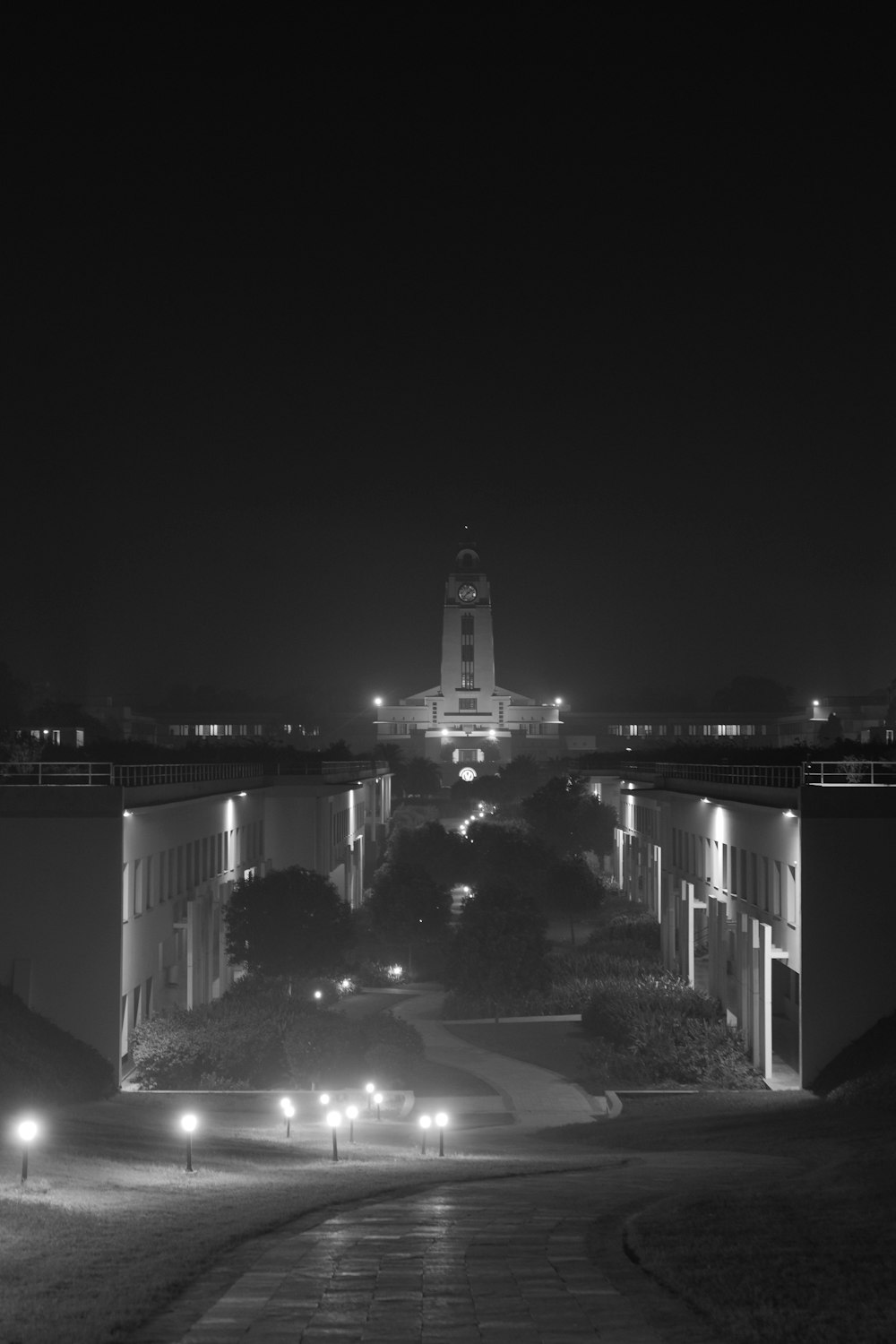 a black and white photo of a city at night