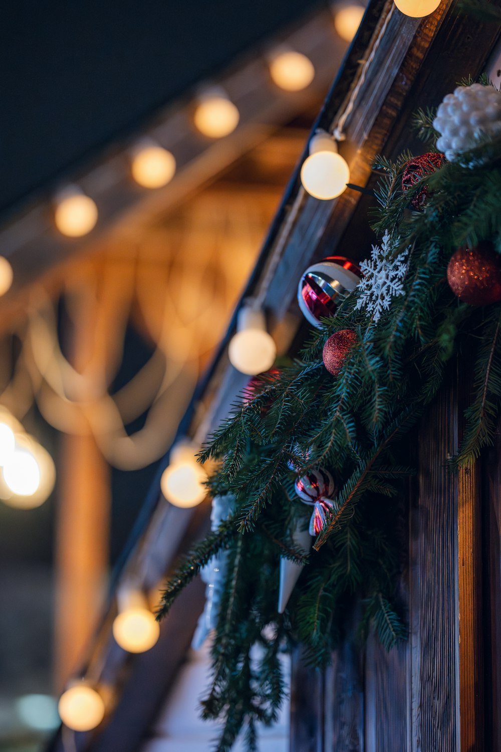 a close up of a christmas wreath on a door