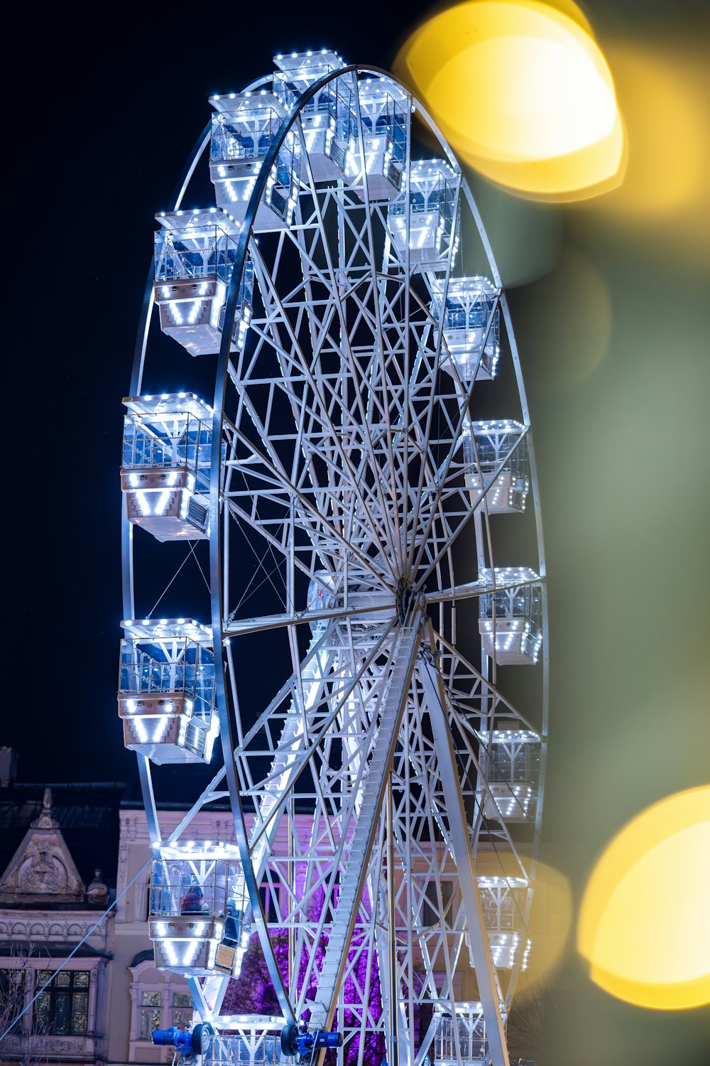 a large ferris wheel lit up at night