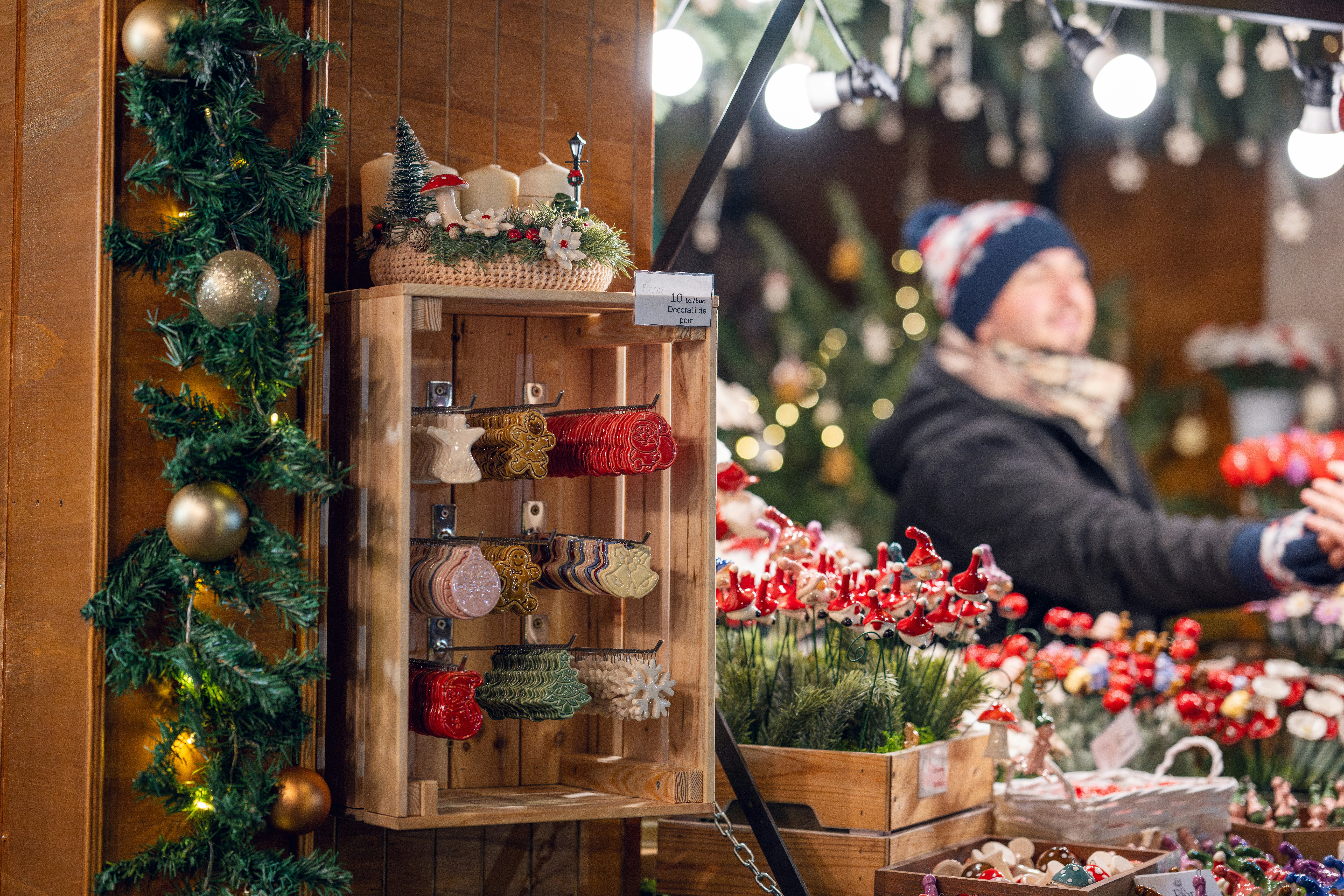 a woman standing in front of a christmas display