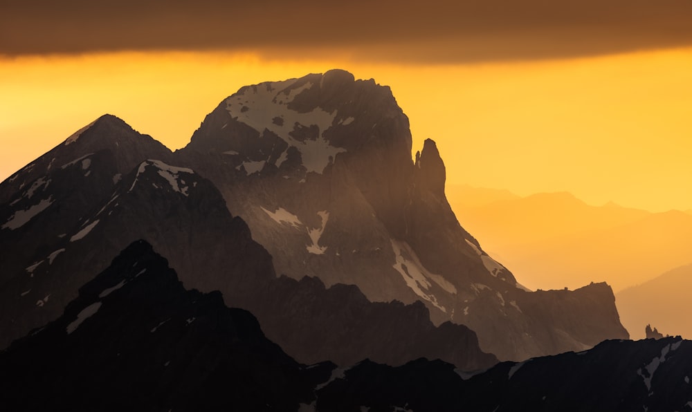 a very tall mountain with a sky background