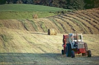 Freshly washed farm equipment parked neatly, looking well maintained.