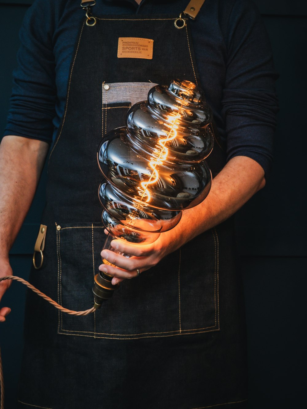 a man holding a light bulb in his hands