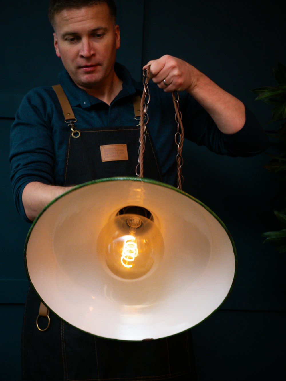 a man holding a light bulb in his hands