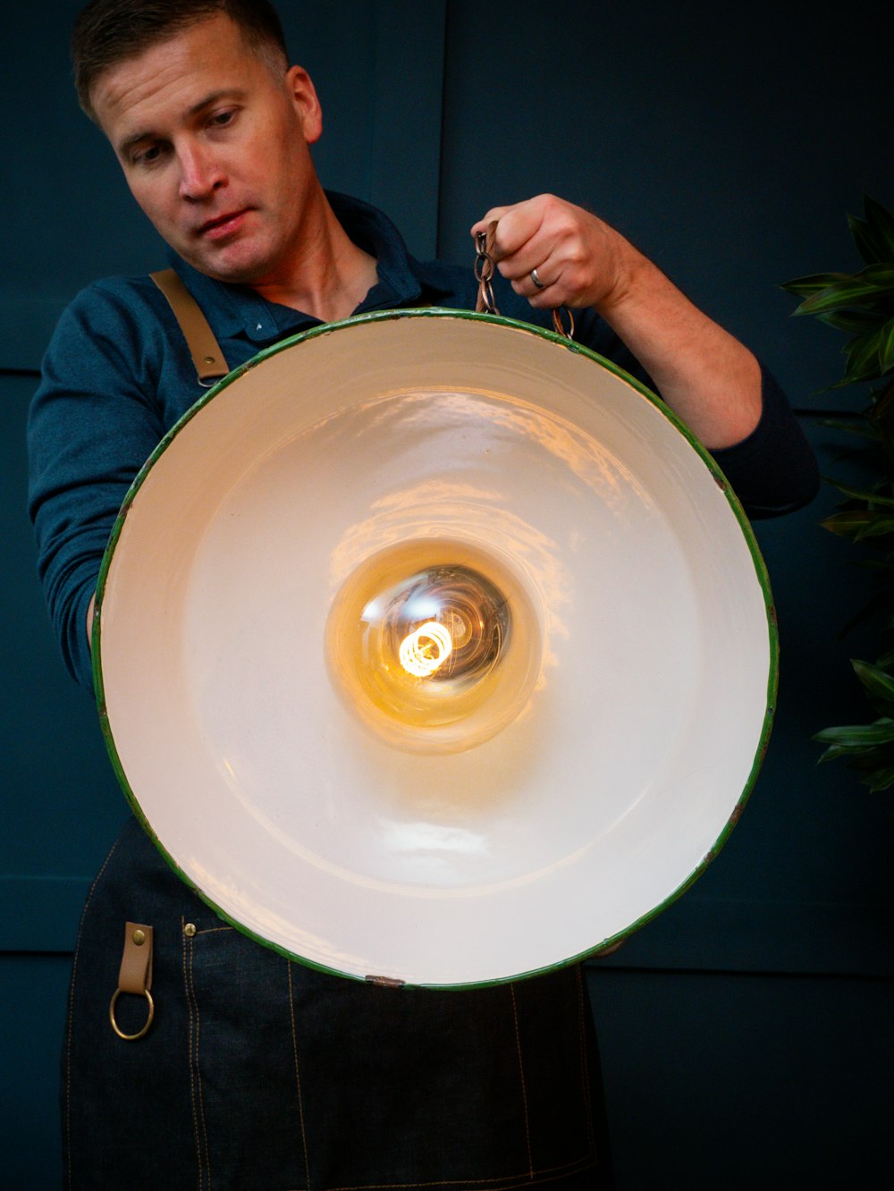 a man holding a large white object in his hands