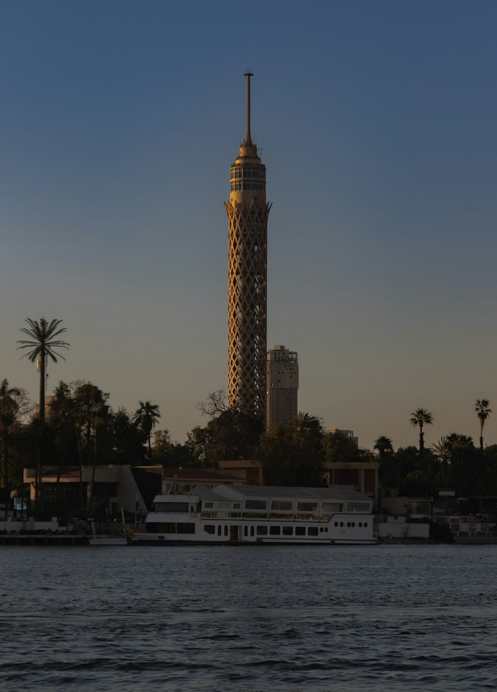 a very tall tower with a clock on it's side