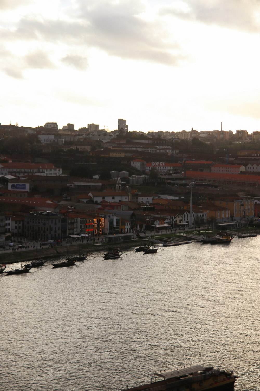 a body of water with a city in the background