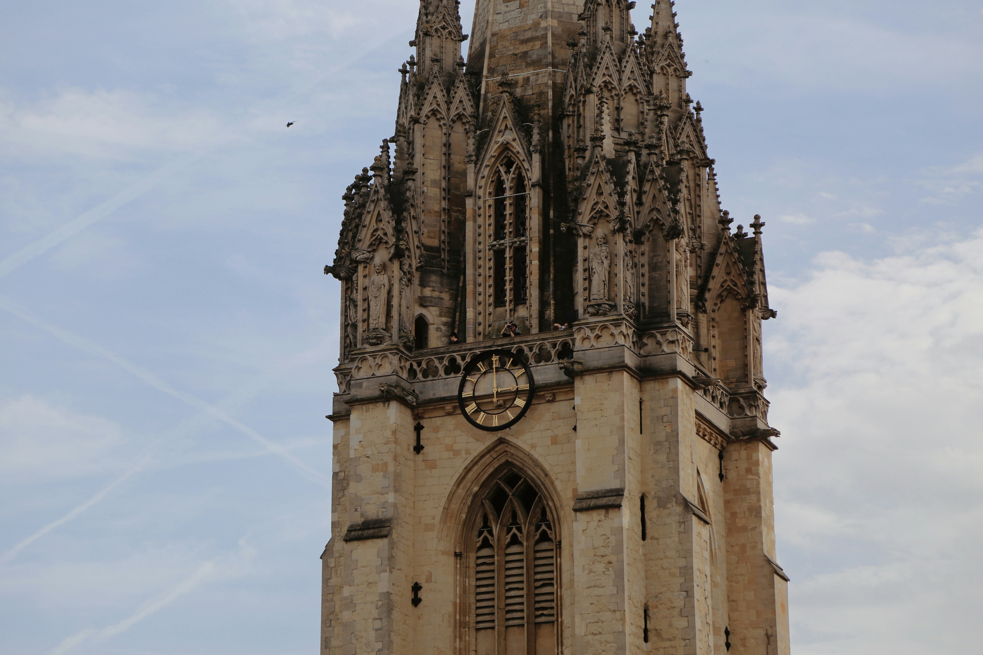 a large clock tower with a sky background