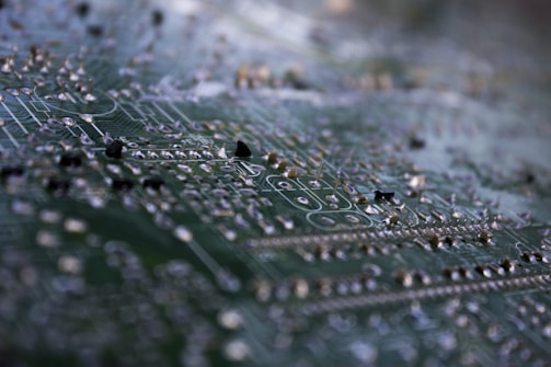 Detailed shot of a circuit board with highlighted traces and solder points.