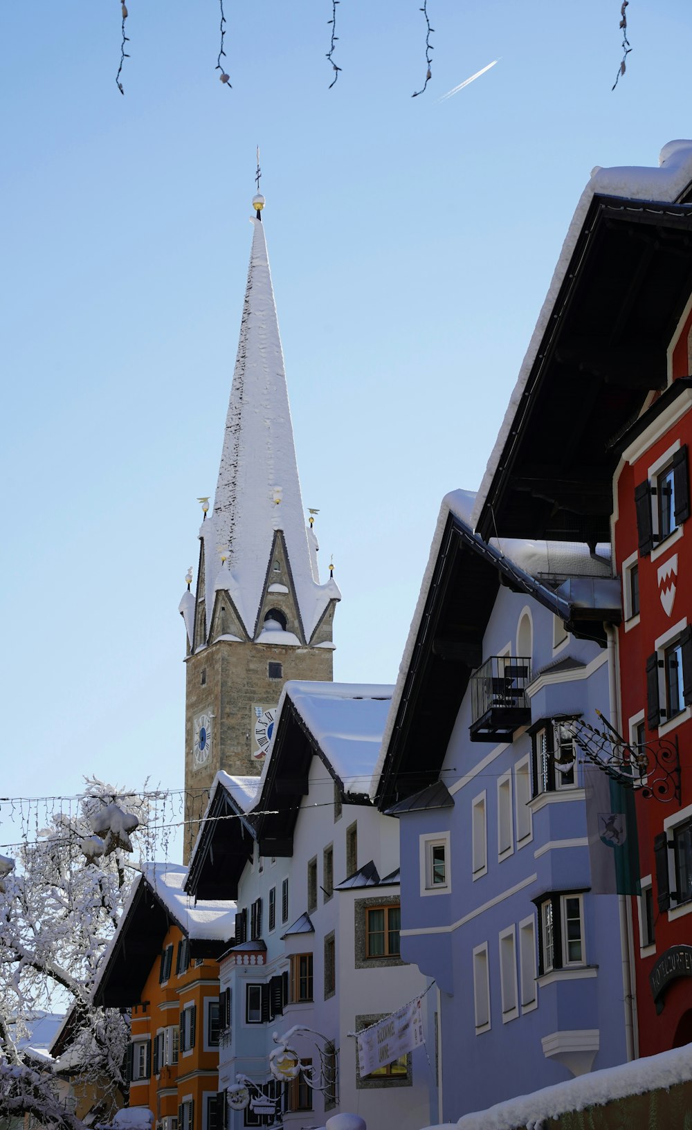 a clock tower towering over a city filled with buildings