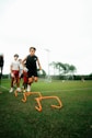 a group of young men playing a game of frisbee