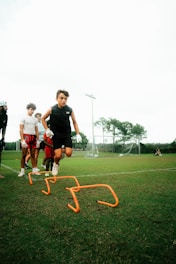 a group of young men playing a game of frisbee