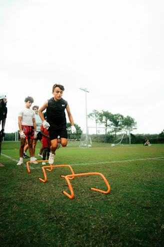a group of young men playing a game of frisbee