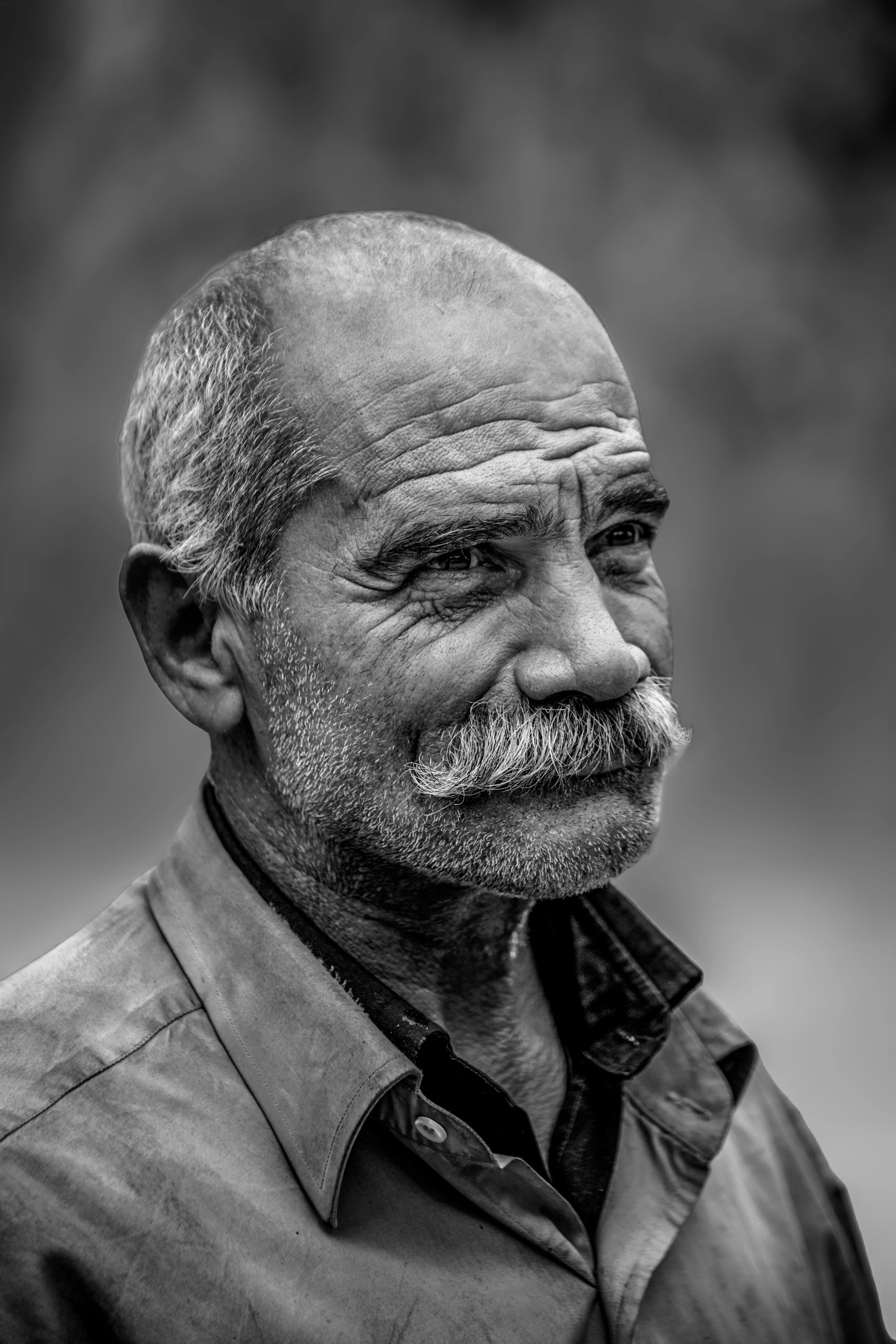 Black and white portrait of a bearded musician