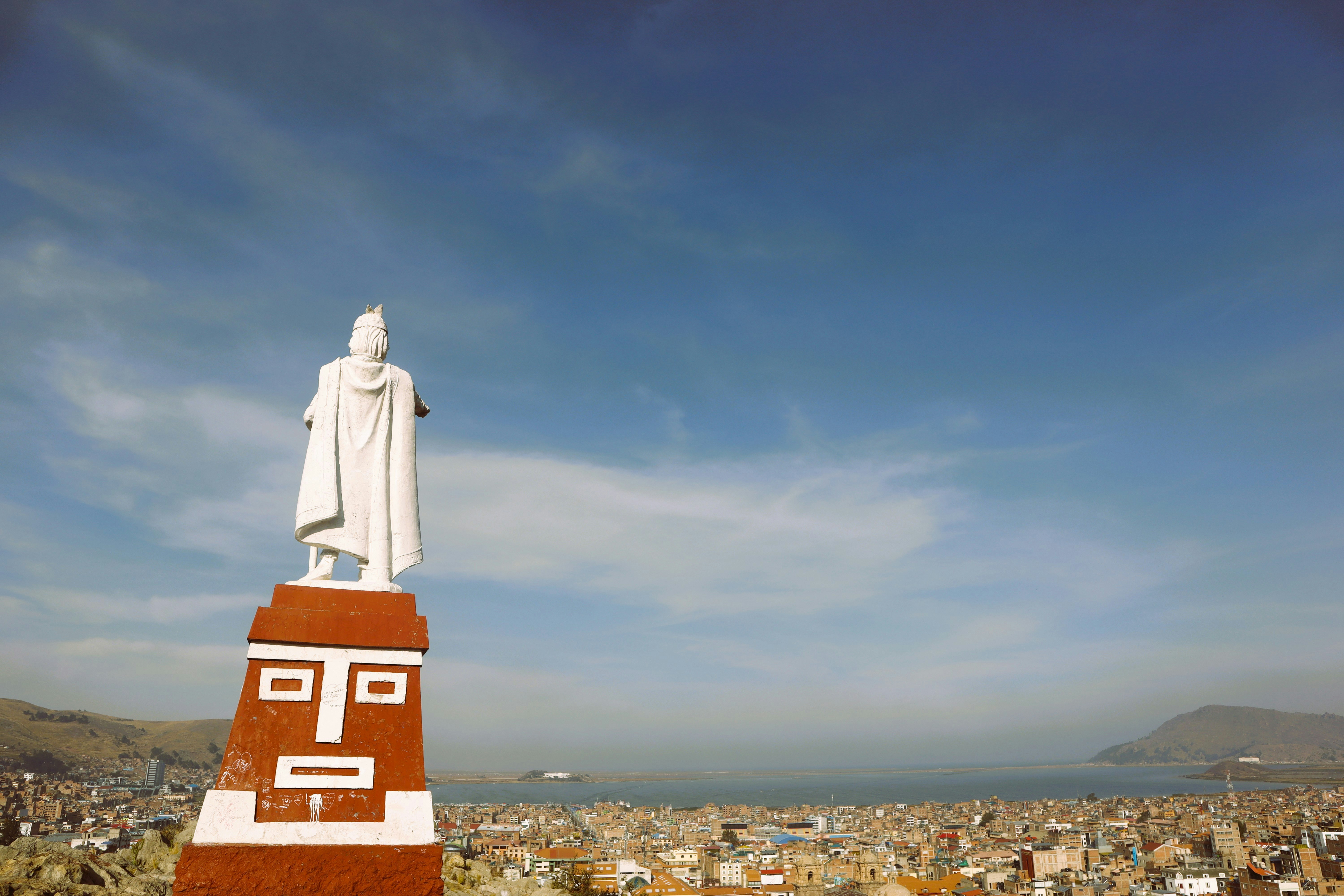 a statue of a person on top of a building, 