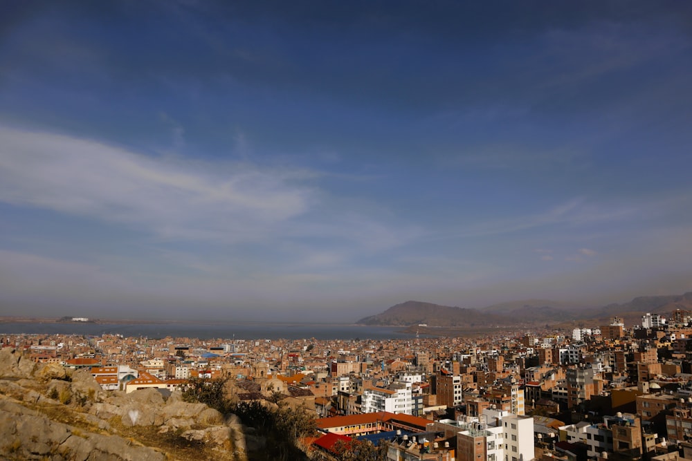 a view of a city with mountains in the background