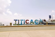a large sign that says tica on the side of a road
