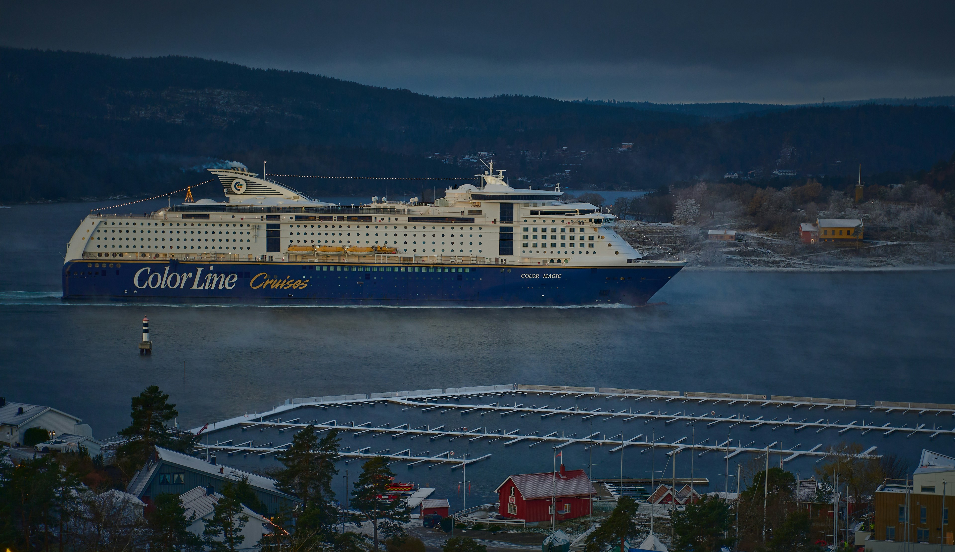 a large cruise ship in the middle of a body of water