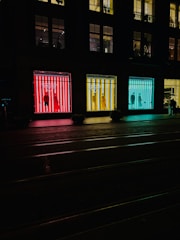 Transparent LED window display installed on a busy retail storefront with bright, clear visuals.
