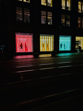 Transparent LED window display installed on a busy retail storefront with bright, clear visuals.