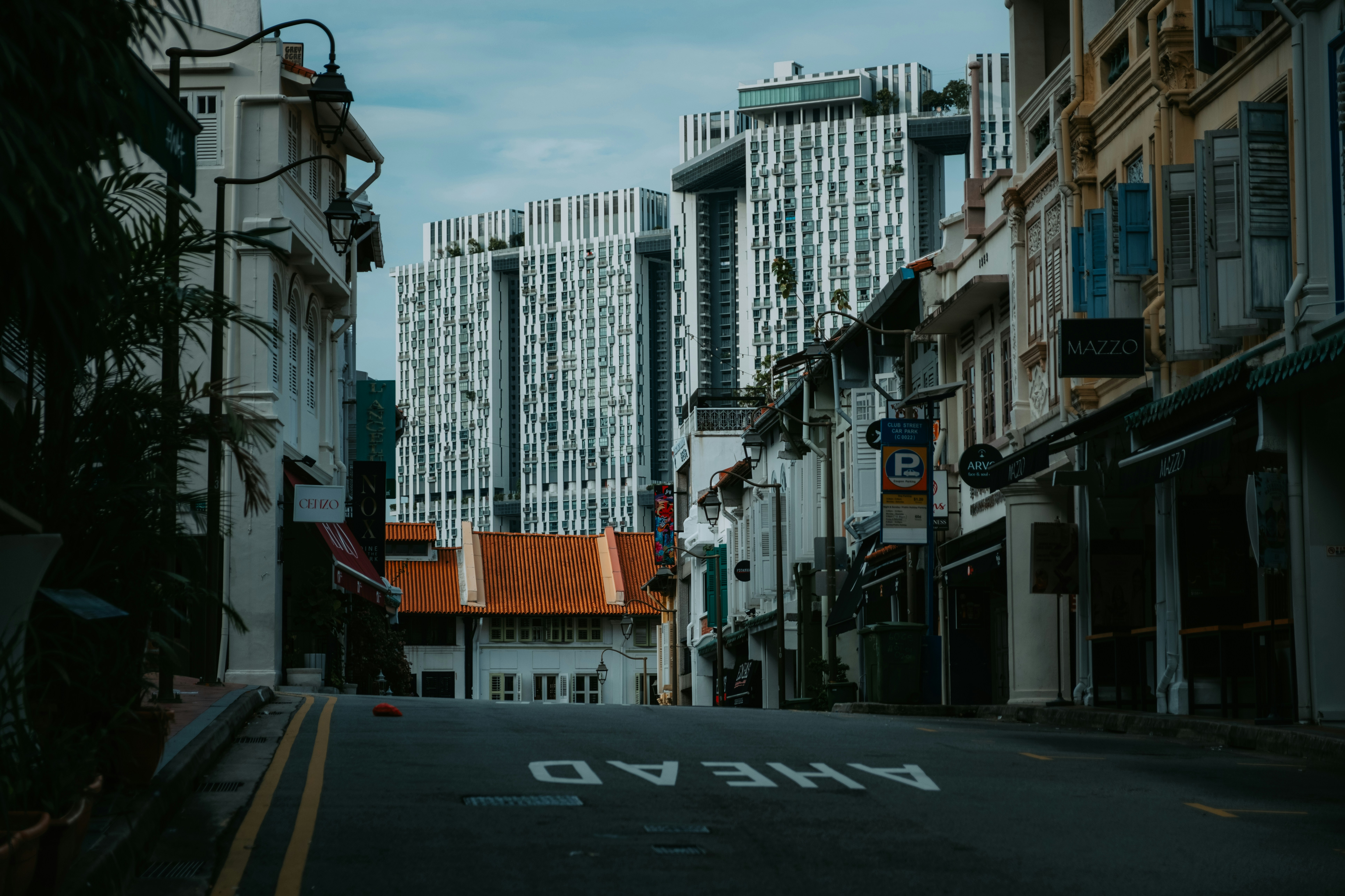 a city street with tall buildings in the background