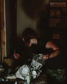 A mechanic discussing with a customer about car parts in a well-lit workshop.