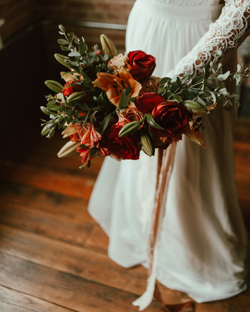 a bride holding a bouquet of flowers in her hands