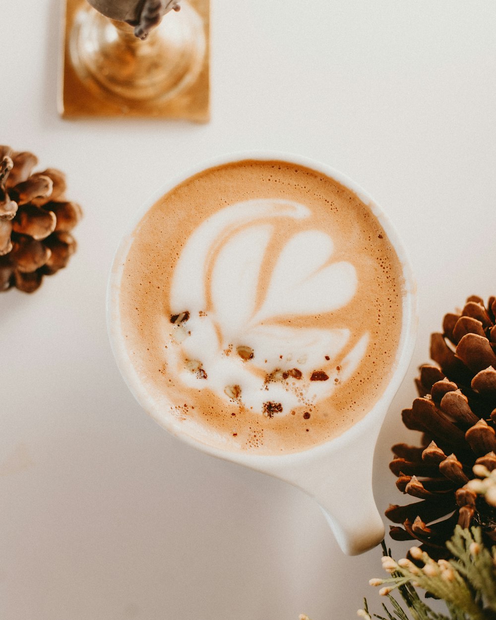 a cappuccino with white cream in a white cup