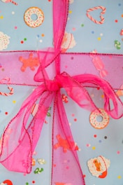 Brightly decorated holiday butterscotch candies wrapped in festive paper with twinkling lights.